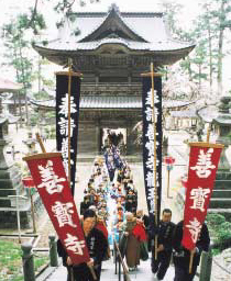 Believers approach the Main Hall, a place of prayer, during the great Naga Festival.